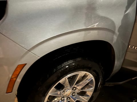 Cleaned alloy wheel and dressed tire on a Chevrolet Tahoe