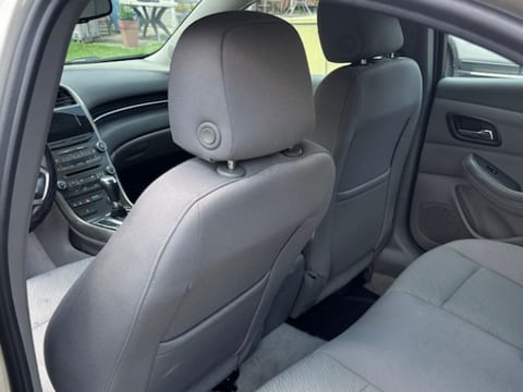 Grey cloth rear seats and carpet cleaned during an interior detail