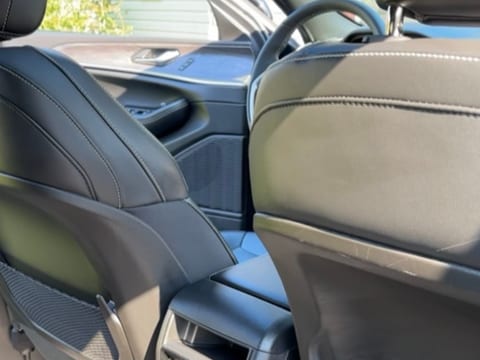 Leather front seats and centre console cleaned during an interior detail