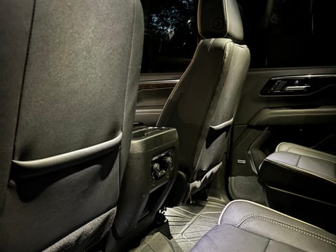 Rear seats and floor of an SUV interior cleaned at the end of an evening job